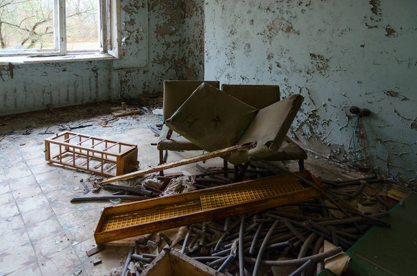 Room in hospital No. 126, dead abandoned ghost town of Pripyat in exclusion zone of Chernobyl NPP, Ukraine - Zdjęcie, obraz