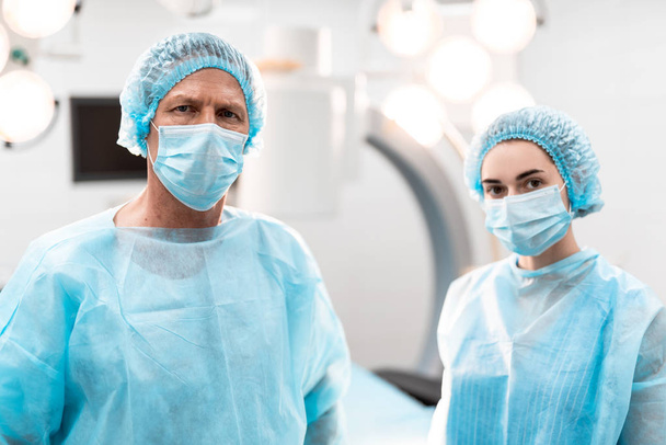 Close up of two medical workers standing together and looking - Photo, Image