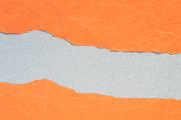 orange torn paper with copy space on gray background texture - Photo, Image