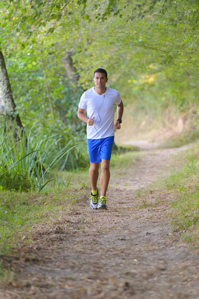 young man jogging and man - Valokuva, kuva