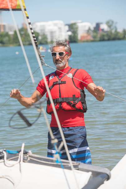 professional waterman training on lake with catamaran - Φωτογραφία, εικόνα
