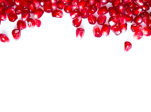 pomegranate seeds isolated on white - Фото, изображение