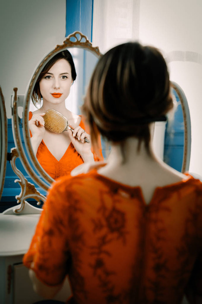 young woman with comb - 写真・画像