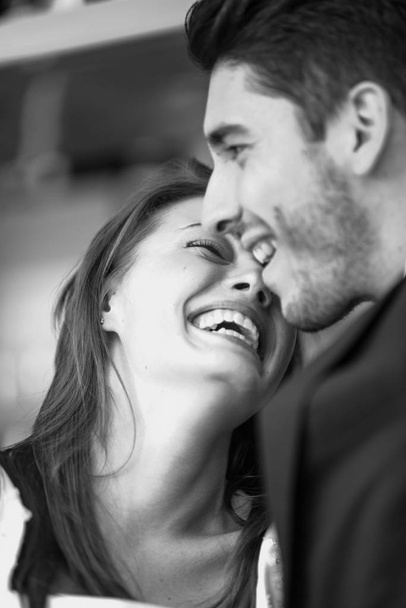 Beautiful couple laughing together during their wedding - Photo, Image