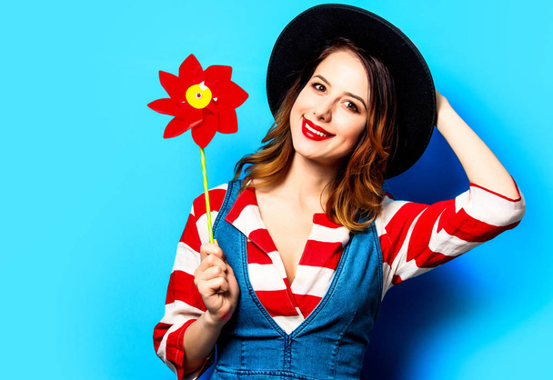 smiling woman with red pinwheel - Photo, Image