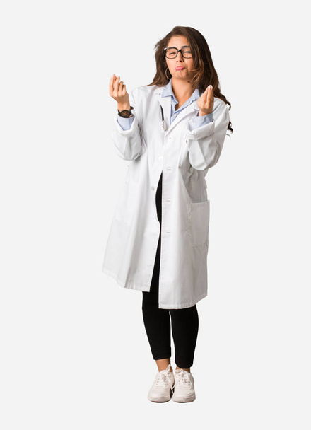 Full body young doctor woman doing a gesture of need - Foto, immagini