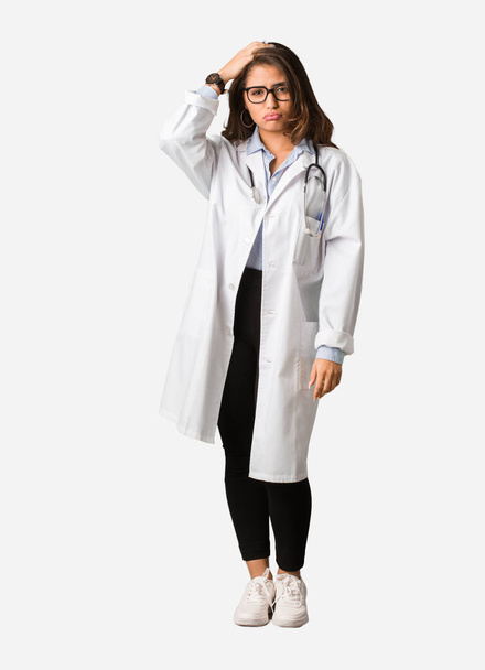 Full body young doctor woman worried and overwhelmed - Foto, imagen