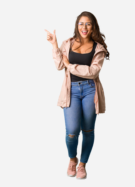 Full body young curvy woman pointing to the side with finger - Fotografie, Obrázek