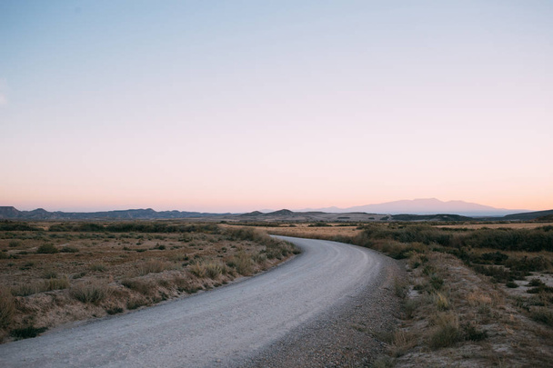 Empty desert road during sunset or sunrise - Photo, image