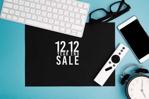 12.12 Year end sale concept, top view of workspace on blue background - Photo, Image