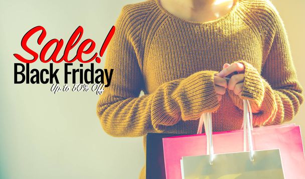 Black Friday sale, Happy girl hold shopping bag - Foto, imagen