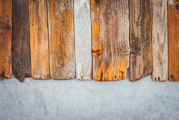 Vintage wooden planks on concrete background. Driftwood and cement texture. - Фото, изображение