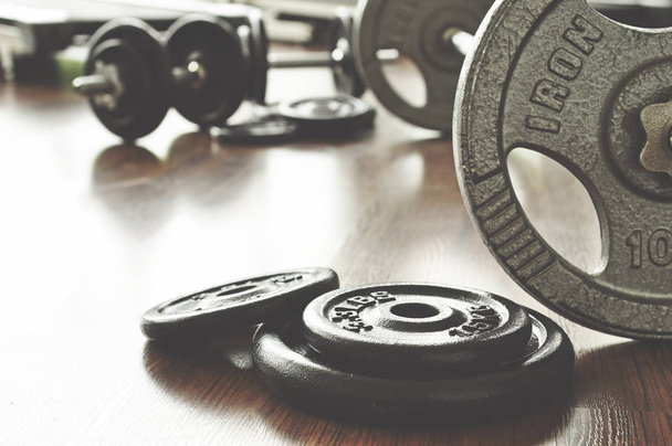 dumbbell and barbell on floor at gym - 写真・画像
