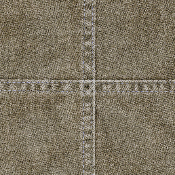 brown denim background decorated with seams in shape of the cross - Foto, Bild