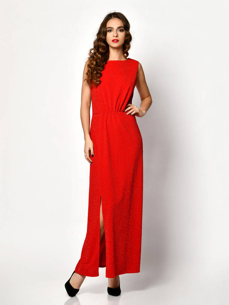 Young beautiful woman posing in new red fashion winter dress full body on a white  - Fotoğraf, Görsel