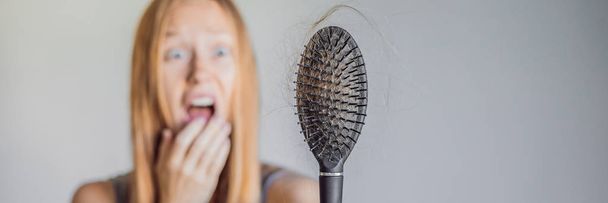 Hair loss in women concept. A lot of lost hair on the comb. BANNER, LONG FORMAT - Foto, afbeelding