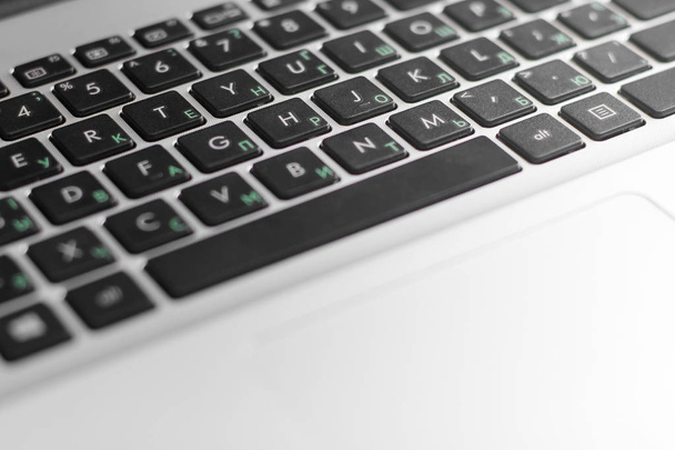 Laptop keyboard with Russian letters - 写真・画像