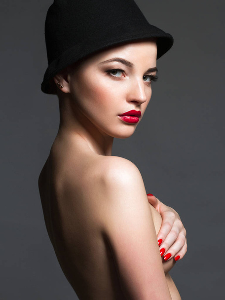 nude beautiful young woman. sexy body girl in hat - Photo, Image