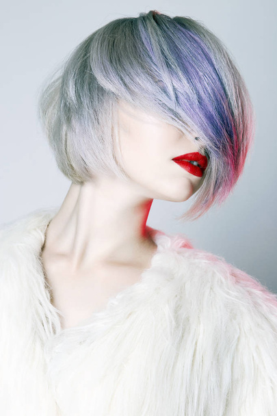 Beautiful Girl with colorful hairstyle, dressed in fur. fashion Beauty Blond Woman with trendy color hair and make-up - Φωτογραφία, εικόνα