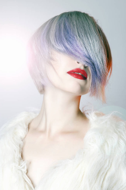 young Woman with colorful Hair, dressed in White Fur. fashion Beauty Model Girl with trendy color hair and red Lips - Valokuva, kuva