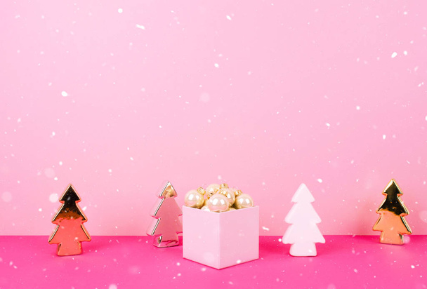 Christmas tree balls on a pink background with a place for your text. - Fotó, kép