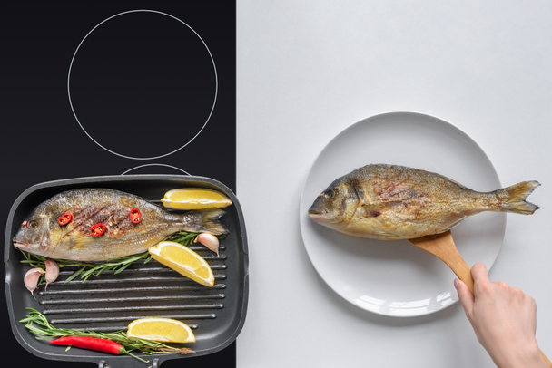おいしい魚のフライを調理木製の道具と人間の手の wshot をトリミング - 写真・画像