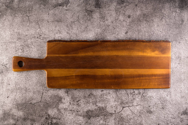 Wooden empty tapas tray board on dark black cement background. - Valokuva, kuva