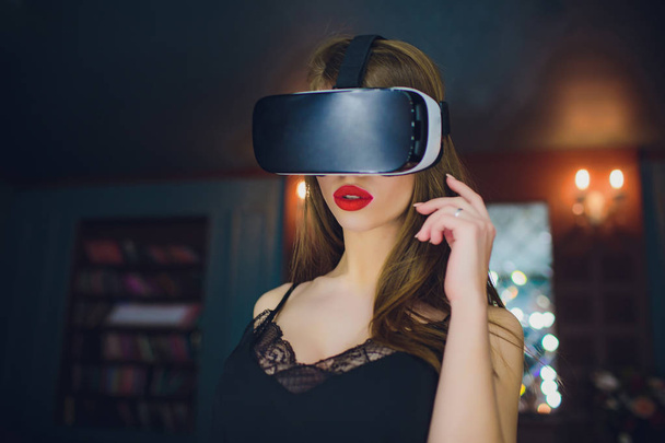 Woman using the virtual reality headset - 写真・画像