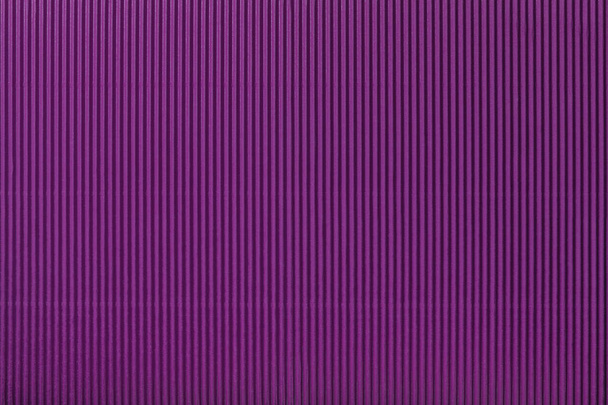 Texture of corrugated dark purple paper, macro. Striped pattern of violet cardboard background, closeup. - Photo, Image