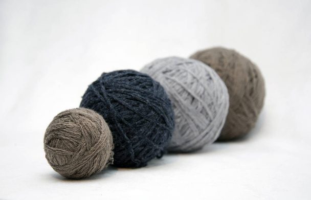Balls of thread, yarn, needlework on a white background. - Zdjęcie, obraz