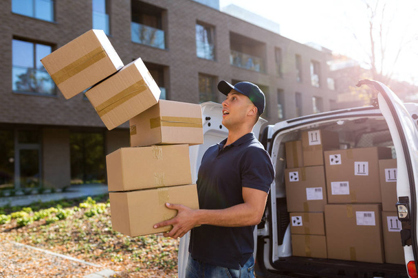 Delivery man dropping boxes  - Fotografie, Obrázek