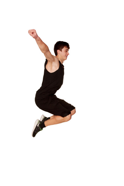 Teen boy playing sports, jumping in the air - Foto, Imagem