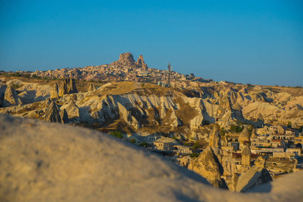 The view from the observation deck of Goreme in Sunny weather: rock the house, the hills and the castle of Uchisar. Turkey, Cappadocia. - Valokuva, kuva