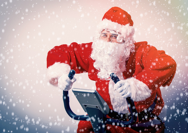 Santa Claus szórakozni Szobakerékpárok - Fotó, kép