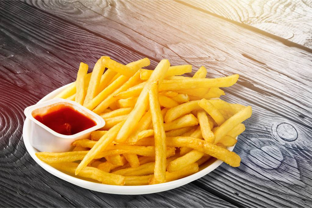 French Fries and ketchup on white plate - Fotó, kép