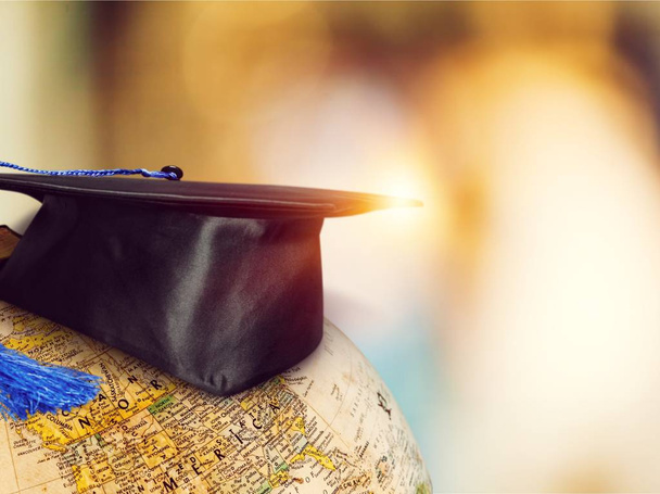 Graduation hat, education concept - Фото, изображение