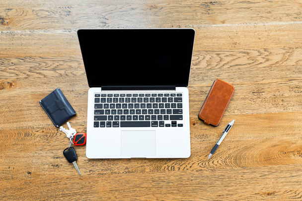 Laptop and other accessories on the desk - Foto, Bild