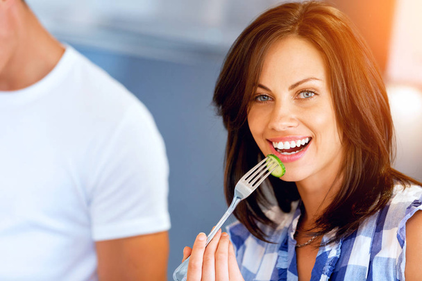 Young woman with a fork - Foto, imagen