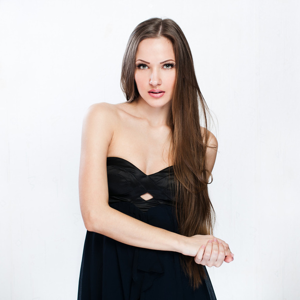 A beautiful woman in a black dress - Fotografie, Obrázek