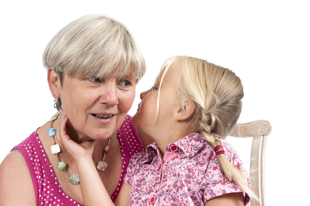 маленькая девочка с бабушкой на белом
 - Фото, изображение