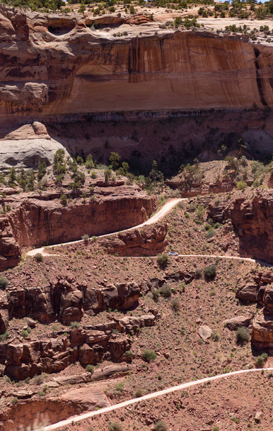 The very scary Shafer Trail in Canyonlands USA. Shafer Trail Road-Shafer Canyon Road is a 18 miles dangerous dirt track located in Moab, a city in Grand County, in eastern Utah, in the western United States. It requires extreme caution  - Photo, Image
