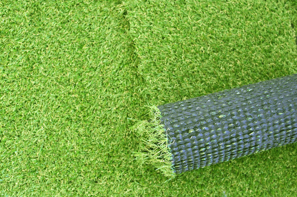 Artificial green grass laying background - Foto, Bild