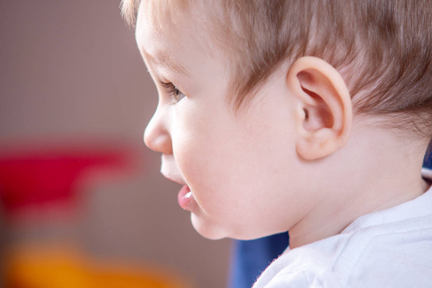 Portrait of cute little boy in profile. Baby seriously looks in the side close-up - Φωτογραφία, εικόνα