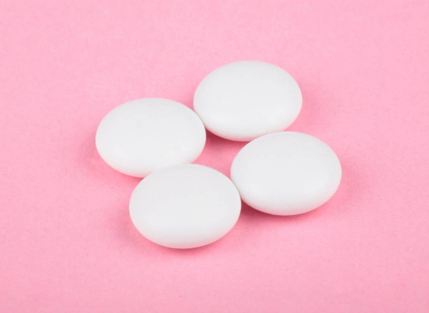 white pill on pink background  - Photo, Image