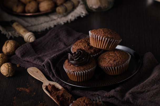 Homemade chocolate muffins with chocolate topping, delish and simple dessert - Foto, imagen