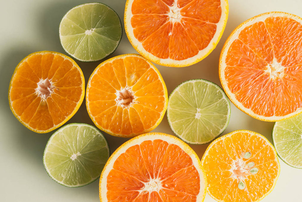 Composition with slices of citrus fruits on white background - 写真・画像