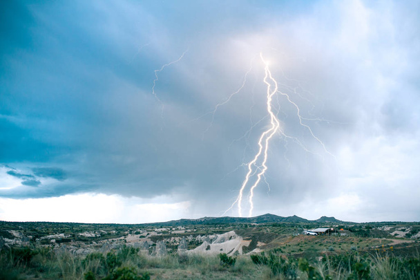 Beautiful view of the sky and lightning on the landscape of Cappadocia in Turkey - Photo, Image