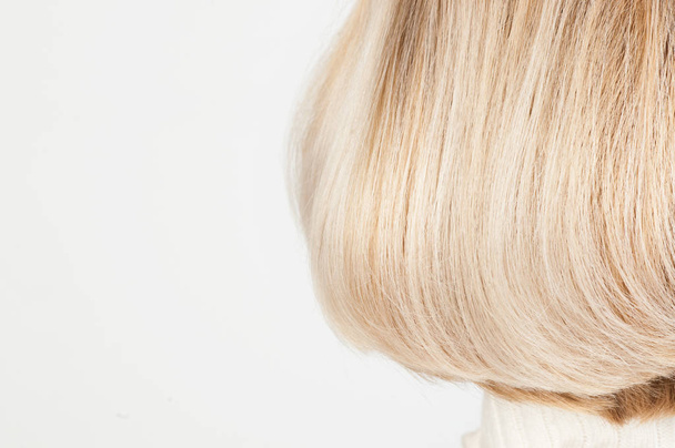 Blonde female hairstyle close up on white - Photo, Image