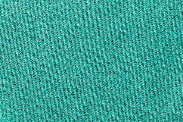 Green fabric background texture. Detail of textile material close-up. - Photo, Image