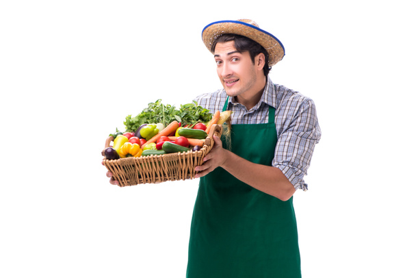 Young farmer with fresh produce isolated on white background - Fotó, kép